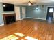 Living room with hardwood floors, fireplace, and built-ins at 323 Breslin St, Wadesboro, NC 28170