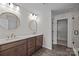 Bathroom featuring dual vanity, wood floors, and glass shower at 622 Amberjack Pl, York, SC 29745