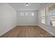 Well-lit room with wood floors, natural light, and a view of the neighborhood at 622 Amberjack Pl, York, SC 29745