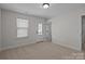 Bright bedroom featuring a door to the outside and neutral carpeting at 622 Amberjack Pl, York, SC 29745