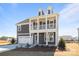 Two-story gray home with a two car garage, covered porch and manicured landscaping at 622 Amberjack Pl, York, SC 29745