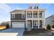 Charming two-story home with a welcoming front porch and a two-car garage at 622 Amberjack Pl, York, SC 29745