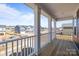 View from a covered porch featuring white columns overlooking a neighborhood at 622 Amberjack Pl, York, SC 29745