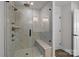 Luxury walk-in shower with bench and bronze fixtures at 622 Amberjack Pl, York, SC 29745