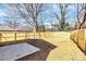 Large backyard with fresh wooden fence, mature trees, and newly installed sod at 624 W Kerr St, Salisbury, NC 28144