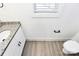 Modern bathroom with granite countertops and wood look floors at 624 W Kerr St, Salisbury, NC 28144