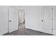 Bedroom with grey carpet and doors to bathroom and hallway at 624 W Kerr St, Salisbury, NC 28144