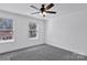 Simple bedroom with ceiling fan and gray carpeting at 624 W Kerr St, Salisbury, NC 28144