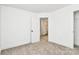 Neutral painted bedroom features neutral carpet, baseboards, and a doorway to the bathroom at 624 W Kerr St, Salisbury, NC 28144