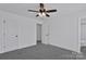 Bedroom with ceiling fan, carpet, and access to bathroom at 624 W Kerr St, Salisbury, NC 28144