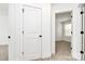 Bright hallway features neutral paint and carpet, white doors, and matte black hardware at 624 W Kerr St, Salisbury, NC 28144