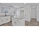 Modern kitchen with white cabinets, granite island, and black faucet at 624 W Kerr St, Salisbury, NC 28144