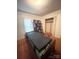 A bedroom area with a bed, window, and closet at 805 Railroad Ave, China Grove, NC 28023