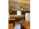 A kitchen area with a large table, refrigerator, and wooden cabinets at 805 Railroad Ave, China Grove, NC 28023