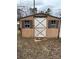 Exterior shot of wooden shed with double doors and windows on either side at 805 Railroad Ave, China Grove, NC 28023