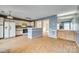 Kitchen featuring white appliances, cabinets, and an open layout to adjacent rooms, creating a functional space at 8218 Legare Ct, Charlotte, NC 28210