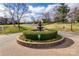 Community water fountain at the center of the property's entrance surrounded by landscaping and well maintained grounds at 8218 Legare Ct, Charlotte, NC 28210