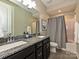 Modern bathroom with double vanity, granite countertop, and a shower/tub combo at 946 Emory Ln, Fort Mill, SC 29708