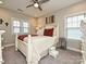 Bedroom with white bed frame, carpet flooring, and two windows at 946 Emory Ln, Fort Mill, SC 29708