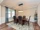 Formal dining room with hardwood floors, chandelier, and a large table at 946 Emory Ln, Fort Mill, SC 29708