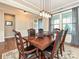 Formal dining room with hardwood floors, chandelier, and a large table at 946 Emory Ln, Fort Mill, SC 29708