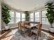 Bright dining area with hardwood floors, large windows, and stylish decor at 946 Emory Ln, Fort Mill, SC 29708