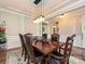 Formal dining room with hardwood floors, chandelier, and a large table at 946 Emory Ln, Fort Mill, SC 29708