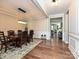 Formal dining room with hardwood floors, chandelier, and a large table at 946 Emory Ln, Fort Mill, SC 29708