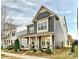 Two story home with gray siding, stone accents, and a front porch at 946 Emory Ln, Fort Mill, SC 29708