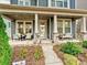 Inviting front porch with stone columns and comfortable seating at 946 Emory Ln, Fort Mill, SC 29708