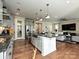 Modern kitchen with stainless steel appliances, granite countertops, and large island at 946 Emory Ln, Fort Mill, SC 29708