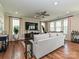 Bright living room with hardwood floors, large TV, and ample natural light at 946 Emory Ln, Fort Mill, SC 29708