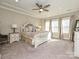 Spacious main bedroom with carpeted floor, ceiling fan, and large windows at 946 Emory Ln, Fort Mill, SC 29708