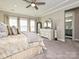 Main bedroom with dresser, large windows and a view of the bathroom at 946 Emory Ln, Fort Mill, SC 29708