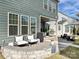 Relaxing patio with seating area and built-in stone wall at 946 Emory Ln, Fort Mill, SC 29708