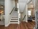 Elegant staircase with hardwood flooring and white risers at 946 Emory Ln, Fort Mill, SC 29708