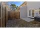 Small backyard with wooden fence and patio at 13660 Meade Glen Ct, Charlotte, NC 28273