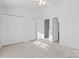 Bright bedroom with double doors and carpet at 13660 Meade Glen Ct, Charlotte, NC 28273