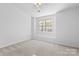 Bright bedroom with neutral walls and carpeted floor at 13660 Meade Glen Ct, Charlotte, NC 28273