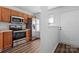 Kitchen with stainless steel appliances and wood cabinets at 13660 Meade Glen Ct, Charlotte, NC 28273