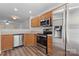 Modern kitchen with stainless steel appliances and wood cabinets at 13660 Meade Glen Ct, Charlotte, NC 28273