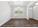 Bright dining room with hardwood floors, coffered ceiling, and large windows at 159 Ella Claire Dr # 008, York, SC 29745