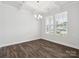 Bright dining room with hardwood floors, coffered ceiling, and large windows at 159 Ella Claire Dr # 008, York, SC 29745