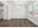 Bright dining room with hardwood floors, coffered ceiling, and large windows at 159 Ella Claire Dr # 008, York, SC 29745