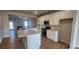 Modern kitchen with white cabinets, granite countertops, an island, and stainless steel appliances at 159 Ella Claire Dr, York, SC 29745