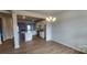 Open kitchen and dining area with an island, stainless appliances, and wood flooring at 159 Ella Claire Dr, York, SC 29745