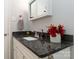 Granite countertop and white cabinets add elegance to this bathroom at 1637 Sumner Dr, Rock Hill, SC 29732