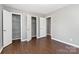 Hardwood floors complement the neutral color scheme in this bedroom at 1637 Sumner Dr, Rock Hill, SC 29732