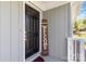 Close-up of a black front door with a welcome sign and grey siding at 1637 Sumner Dr, Rock Hill, SC 29732