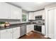 Modern kitchen with stainless steel appliances, white cabinets, and a window view at 1637 Sumner Dr, Rock Hill, SC 29732